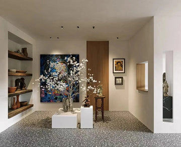 Modern art gallery interior with terrazzo flooring, contemporary art installations, and minimalist display shelves
